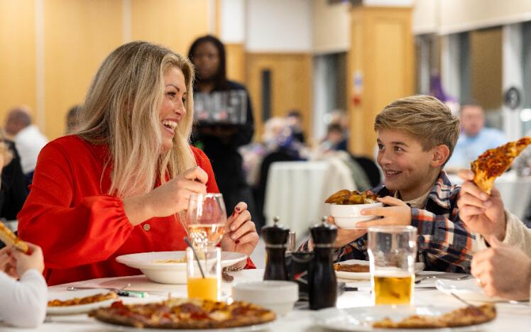 A mother and son enjoying hospitality at Newcastle Races